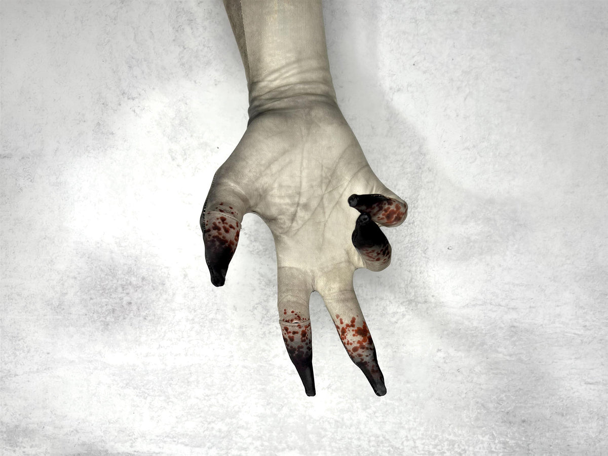 Dead skin costume gloves, pale print, close up