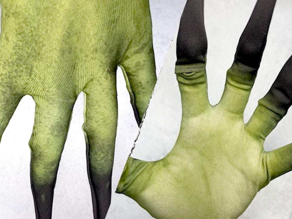 Long finger costume gloves, green skin print, close up