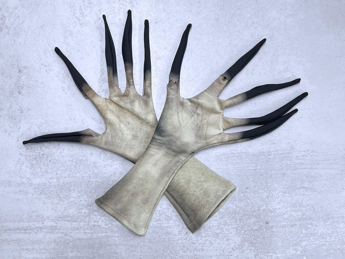Long finger costume gloves, pale white dead skin print with black claw tips, crossed pair