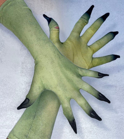 A pair of tight printed fabric gloves with fingers spred. The printed fabric looks like real, but green skin that fade to extented black finger tips.