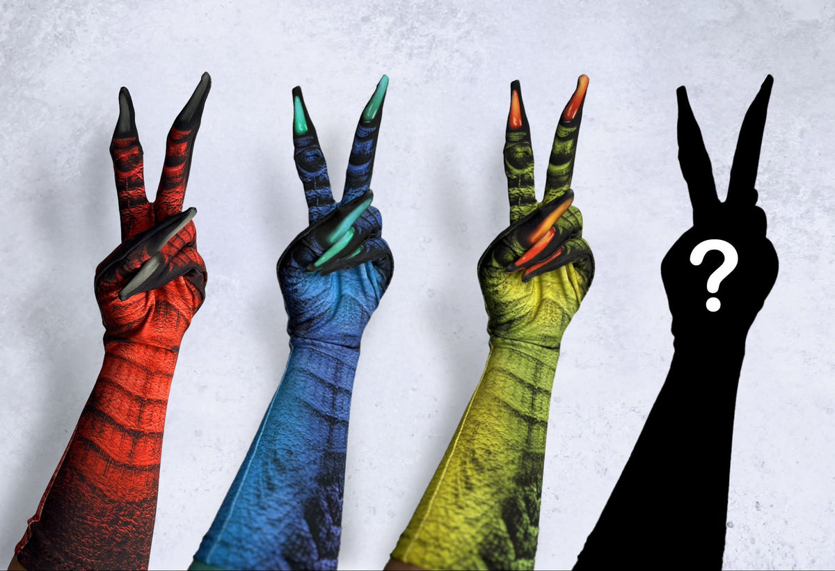Four human arms raised in peace signs, each printed with a different colorful reptile or dragon skin patterned costume gloves in red, blue, green, and customizable options, against a light gray textured background.