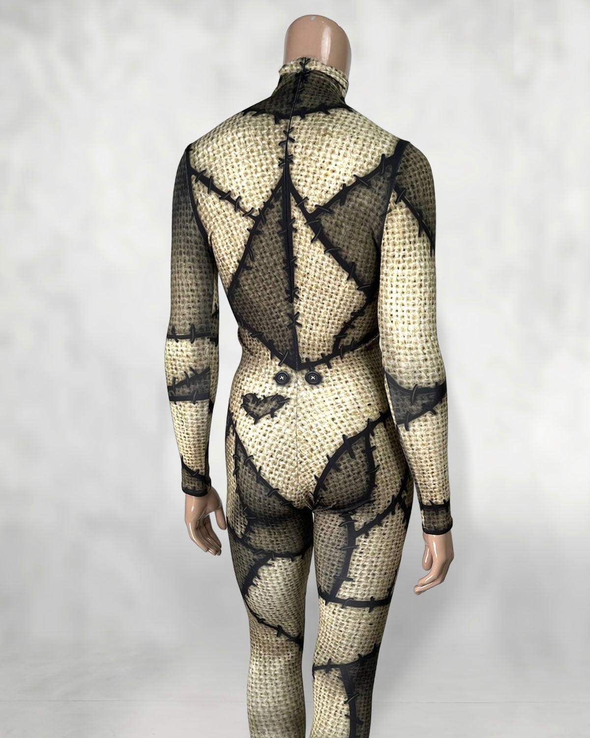 Women's burlap patchwork doll catsuit, back view with back zip, buttons and heart patch